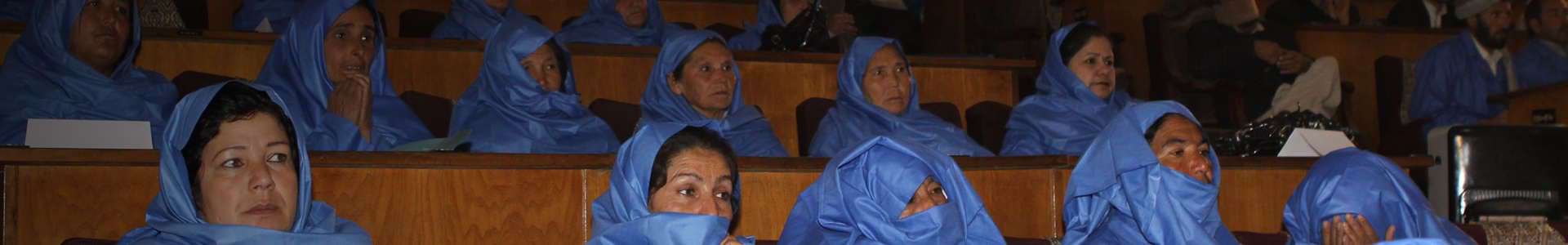 Photo of health workers wearing personal protective equipment attending a lecture