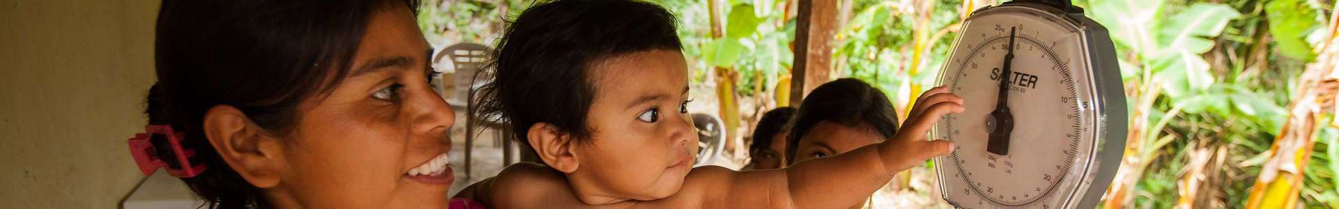 Photo of toddler being weighed in Honduras